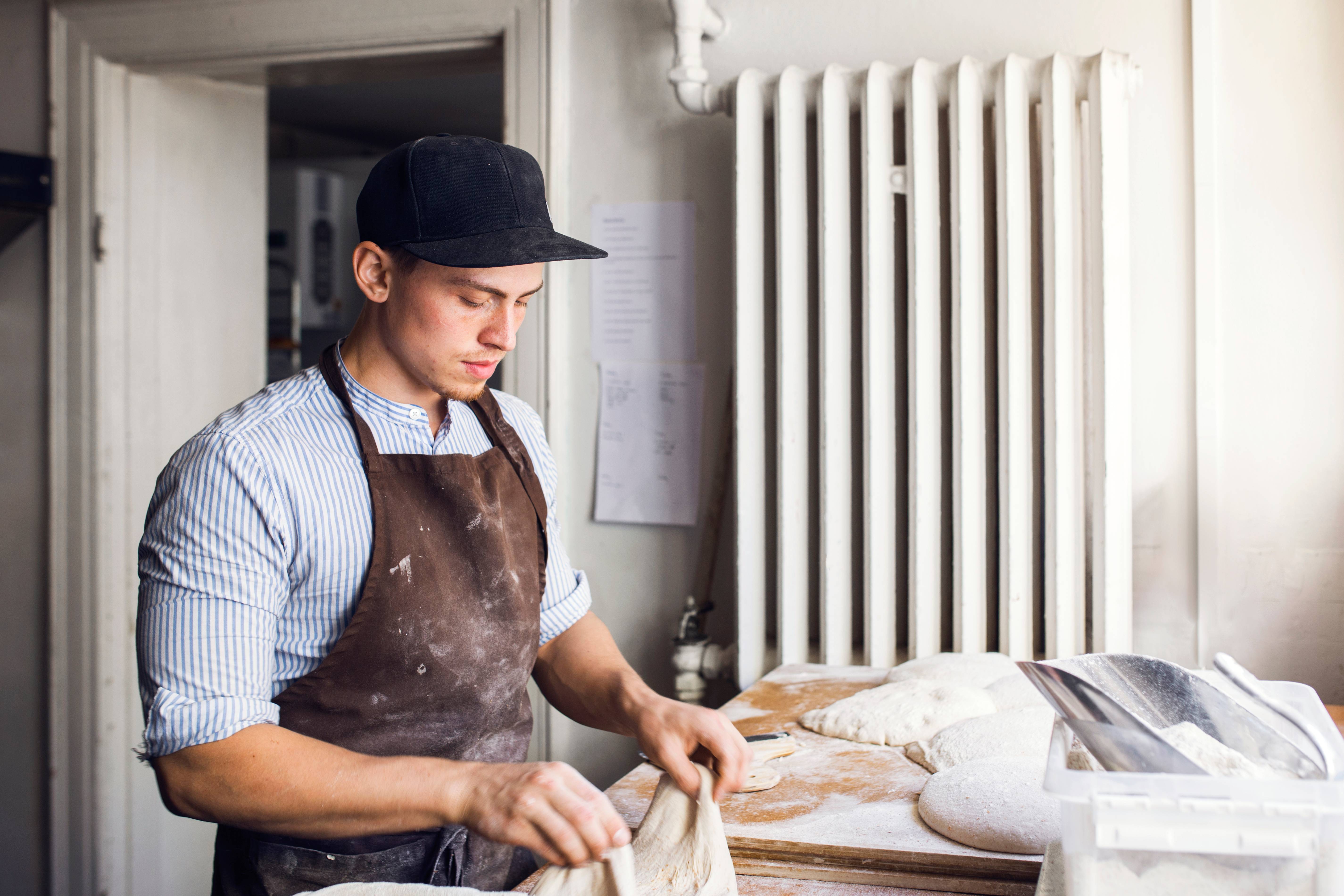 baker preparing dough kitchen 2021 08 28 23 36 47 utc | default.project.name